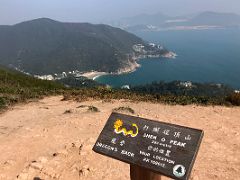 09A Shek O Peak 284m sign with Pottinger Peak, Big Wave Bay and Fat Tong O in distance Dragons Back hike Hong Kong